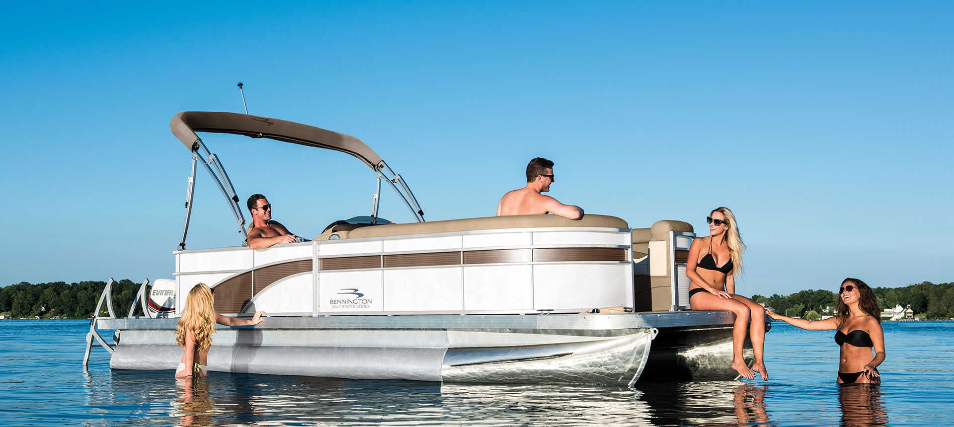 Tritoon boat on Torch Lake