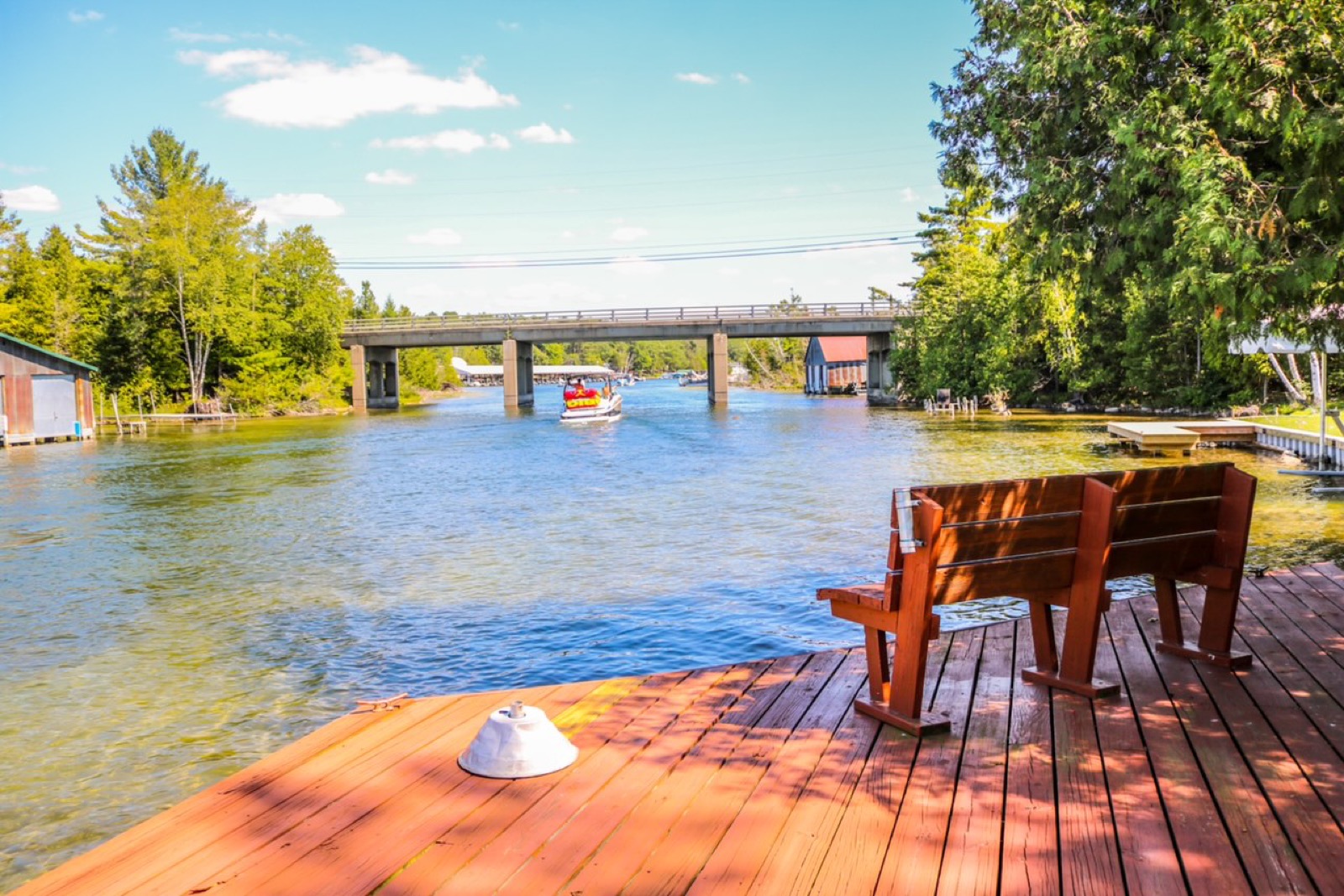Dock and bench on the Clam River at The Boathouse, Torch Lake