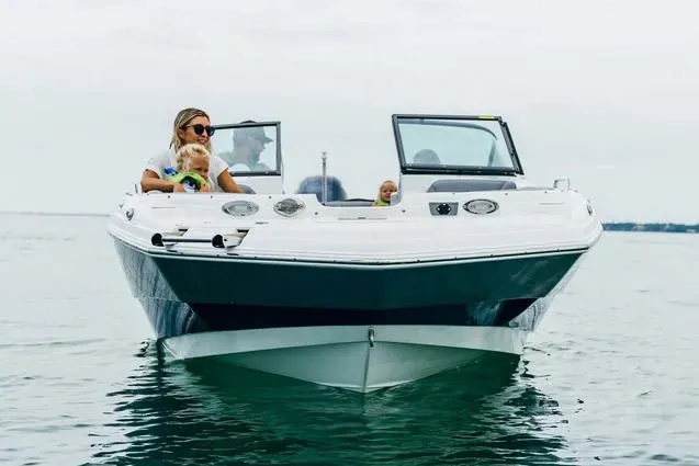 Nautilus Deck Boat with family enjoying Torch Lake