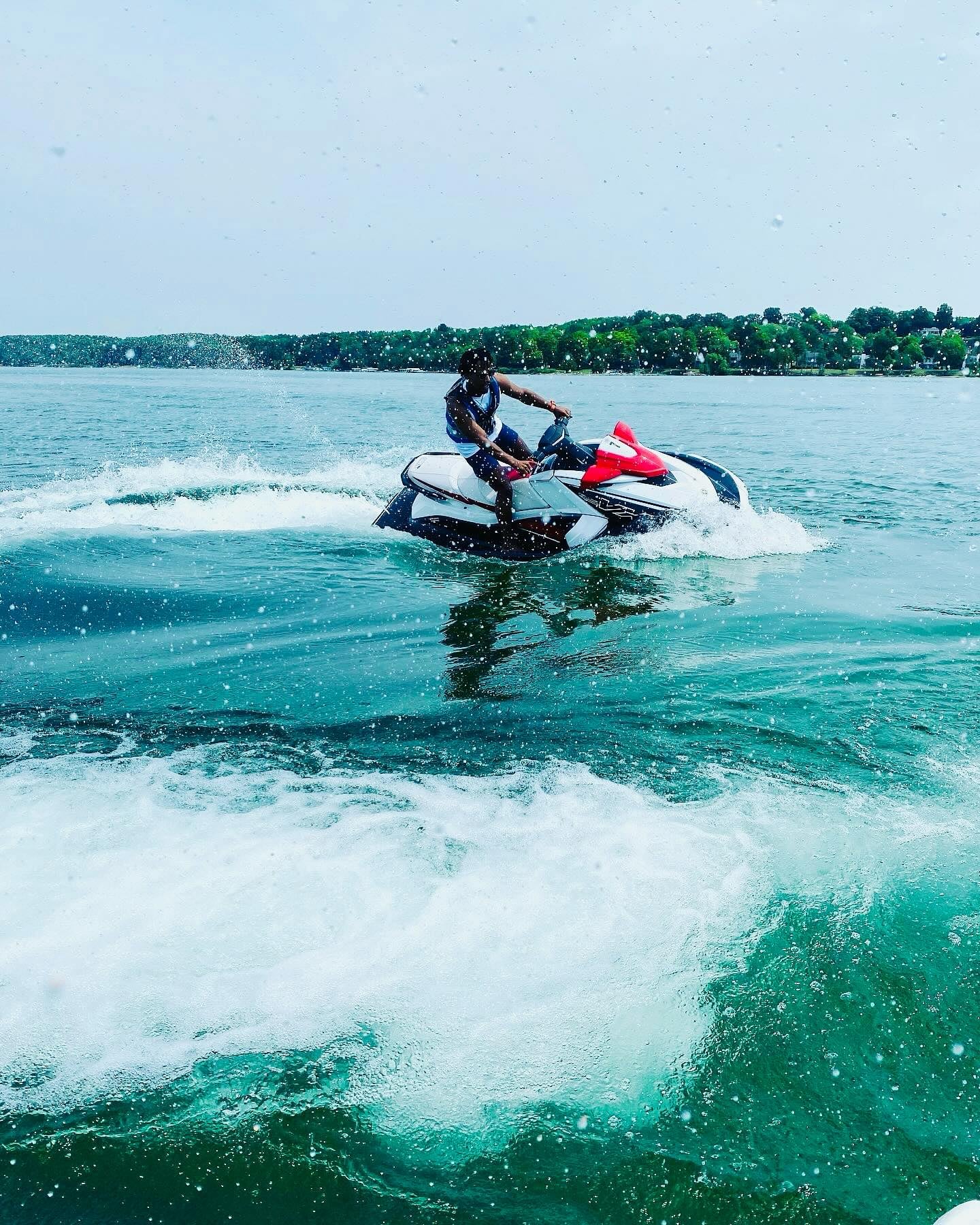 Aerial view of Torch Lake's turquoise waters